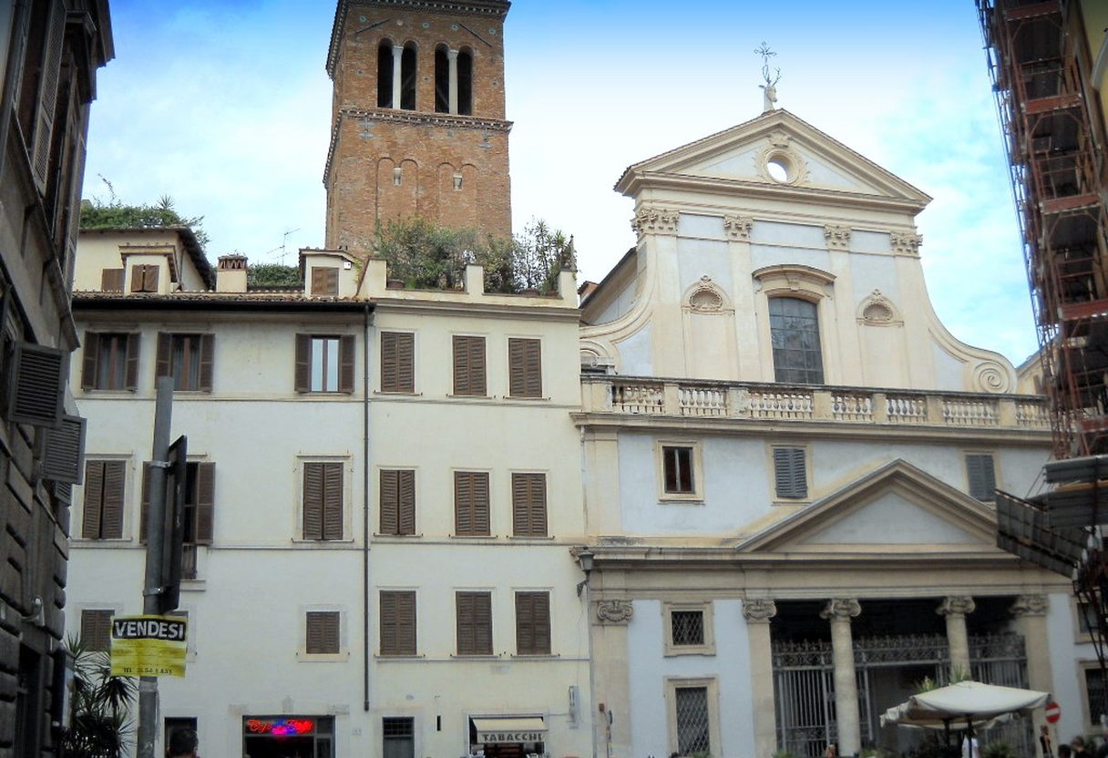 Baroque facade and Romanesque bell tower of Sant'Eustachio church rising over the small piazza in central Rome