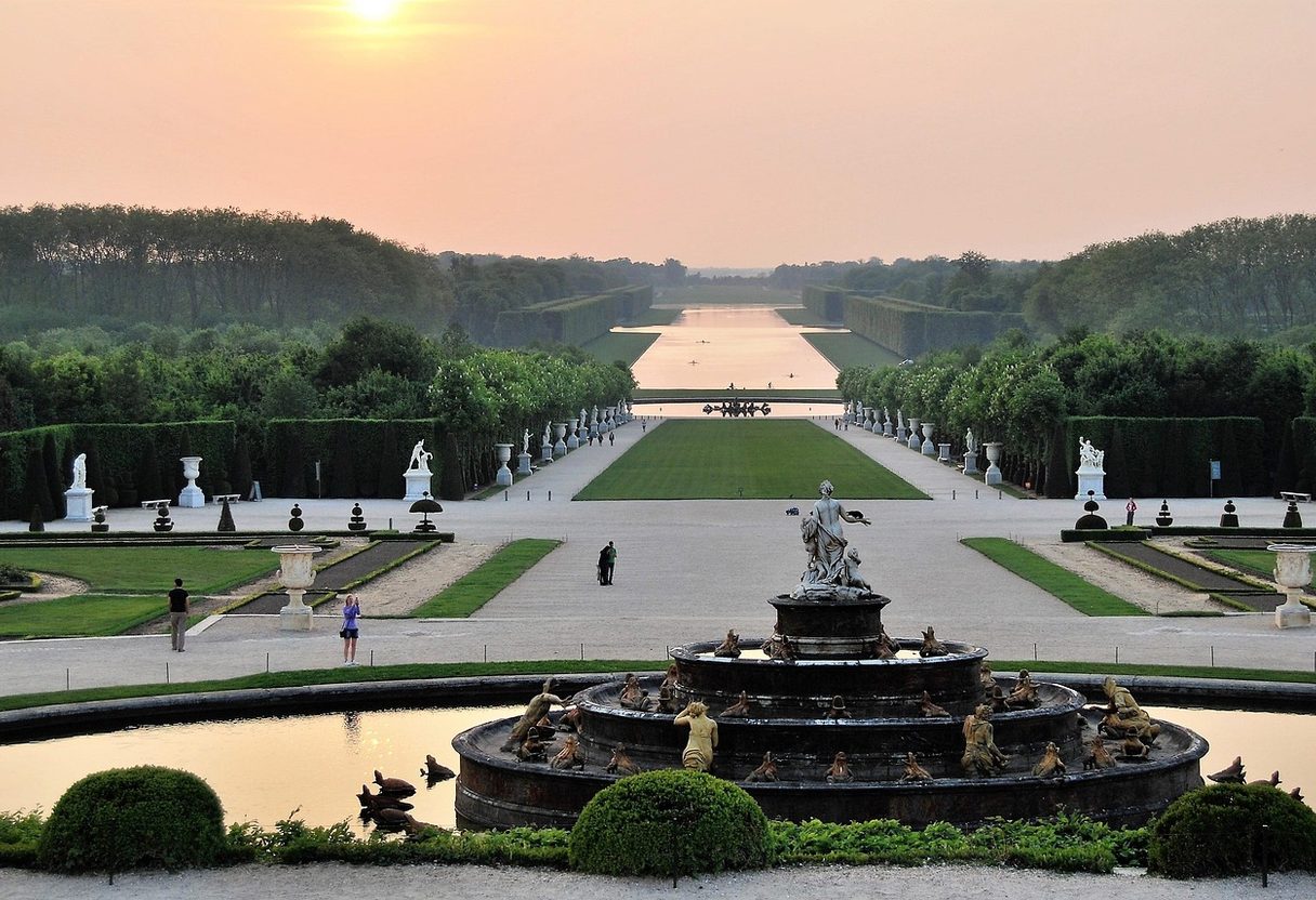 Latona Fountain overlooking the Tapis Vert and Grand Canal stretching to the horizon at sunset
